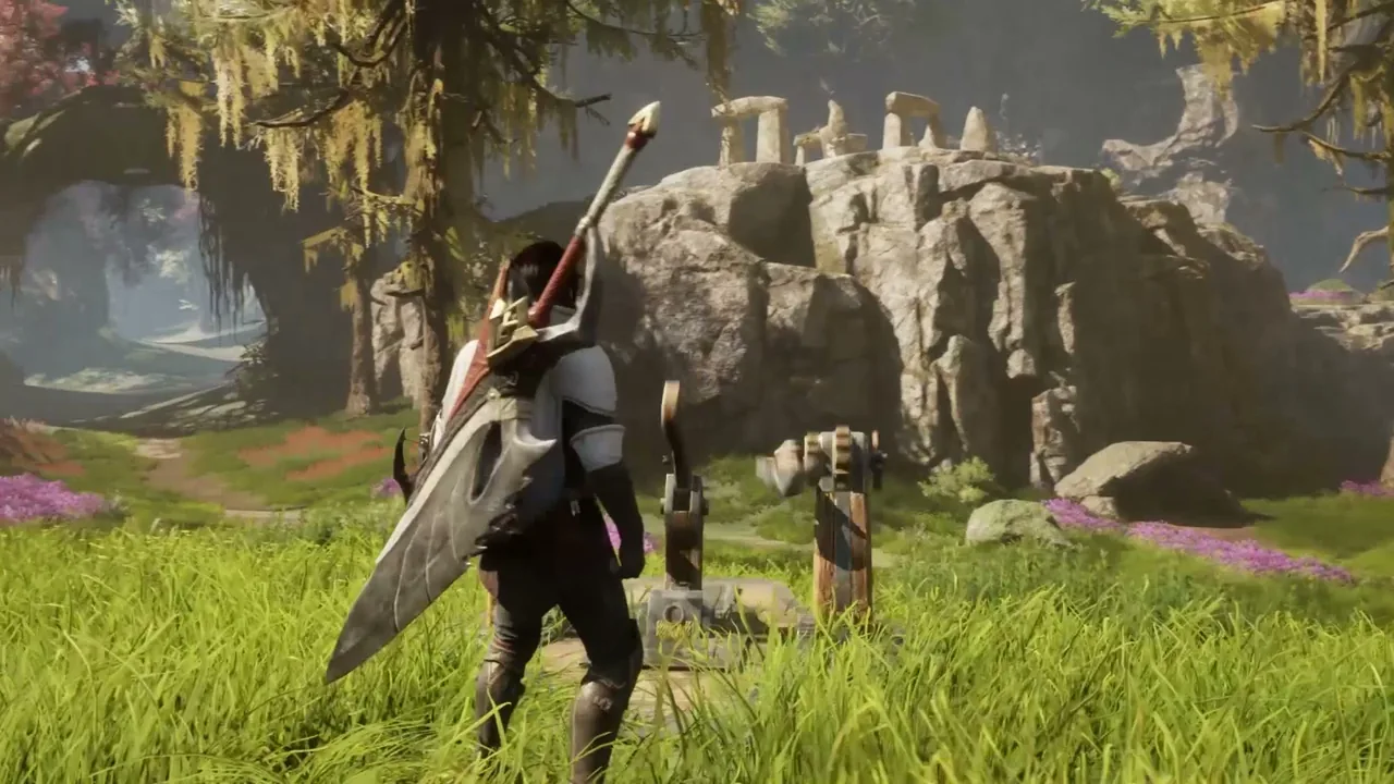 A hunter carrying a Great Sword walks through tall grass toward rocky ruins in Aesoland in Monster Hunter Outlanders gameplay